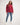 Person wearing a red jumper with a white background