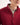 Person wearing a red jumper with a white background