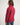 Person wearing a red jumper with a white background