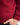 Person wearing a red jumper with a white background
