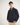 Person wearing a navy blue jumper with a white background