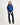 Girl wearing a blue jumper with a white background