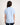 Girl wearing a light blue polo shirt on a white background