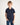 Boy wearing a navy blue polo shirt on a white background