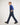 Boy wearing blue jeans and a blue shirt on a white background