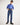 Boy wearing a blue shirt and jeans on a white background