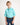 Young boy wearing an aqua shirt and jeans on a white background