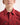 Young boy wearing a red workshirt on a white background