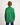 Boy wearing a green workshirt with a plain background