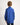 Young boy wearing a dark blue workshirt with a white background