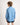 Boy wearing a light blue shirt and dark shorts on a white background