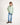 Young girl wearing a light green jumper with a white background