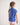 Young girl wearing a blue polo shirt and pink shorts on a white background
