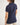 Girl wearing a navy polo shirt on a white background