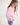 Girl wearing a pink workshirt with a visible RB logo on a white background