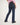 Girl wearing blue jeans and a pink shirt on a white background