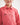 Close-up of a girl wearing a pink workshirt with a brand logo on a white background