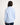 Girl wearing a light blue jacket on a white background
