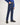 Boy wearing blue jeans and a blue shirt on a white background
