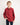 Young boy wearing a red workshirt on a white background