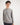 Boy wearing a gray long-sleeve shirt on a white background